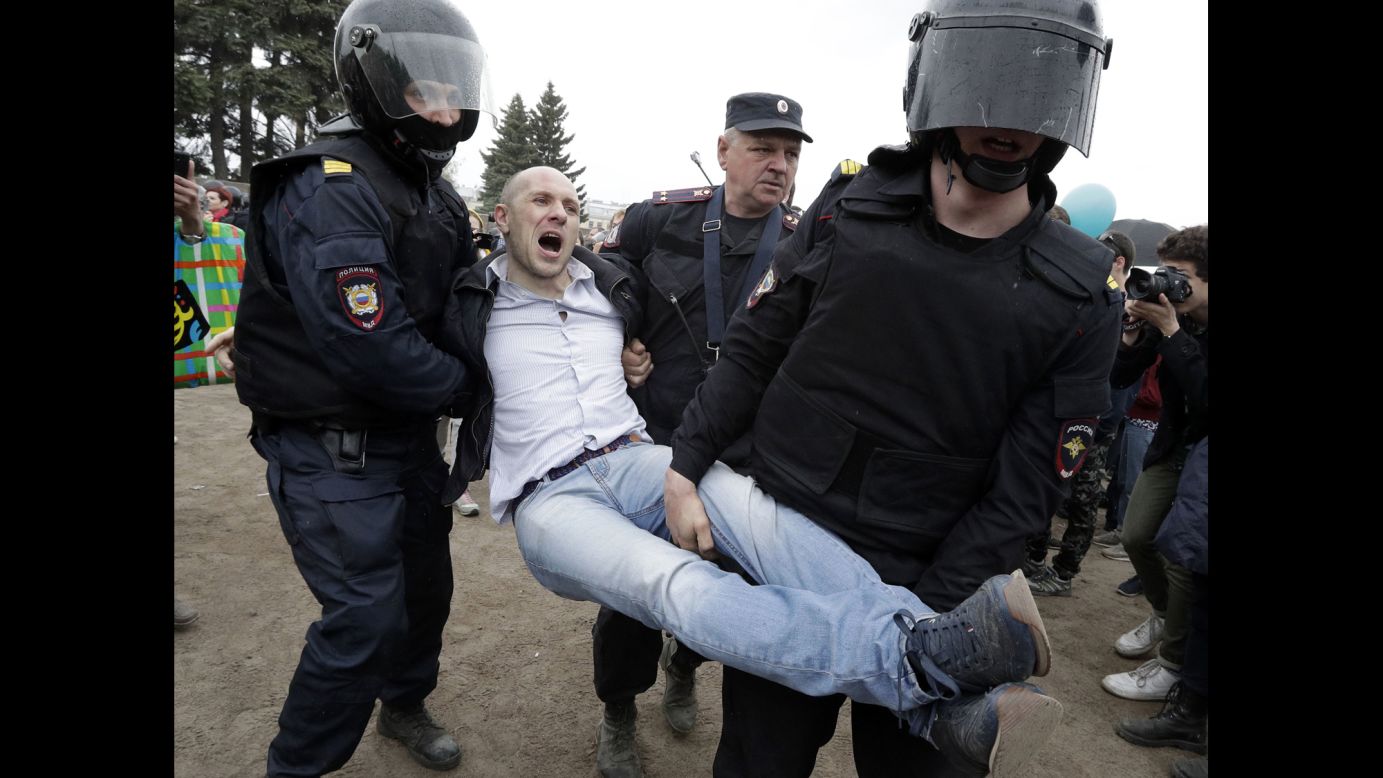 Police detain a protester during anti-corruption rally in St. Petersburg.