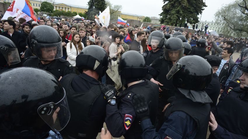 Russian police officers face demonstrators during an unauthorized opposition rally in centre of Saint Petersburg on June 12, 2017. 
Over 200 people were detained on June 12, 2017 by police at opposition protests called by Kremlin critic Alexei Navalny, said a Russian NGO tracking arrests. "About 121 people were detained in Moscow up to this point. In Saint-Petersburg - 137," OVD-Info group, which operates a detention hotline, wrote on Twitter.
 / AFP PHOTO / OLGA MALTSEVA        (Photo credit should read OLGA MALTSEVA/AFP/Getty Images)