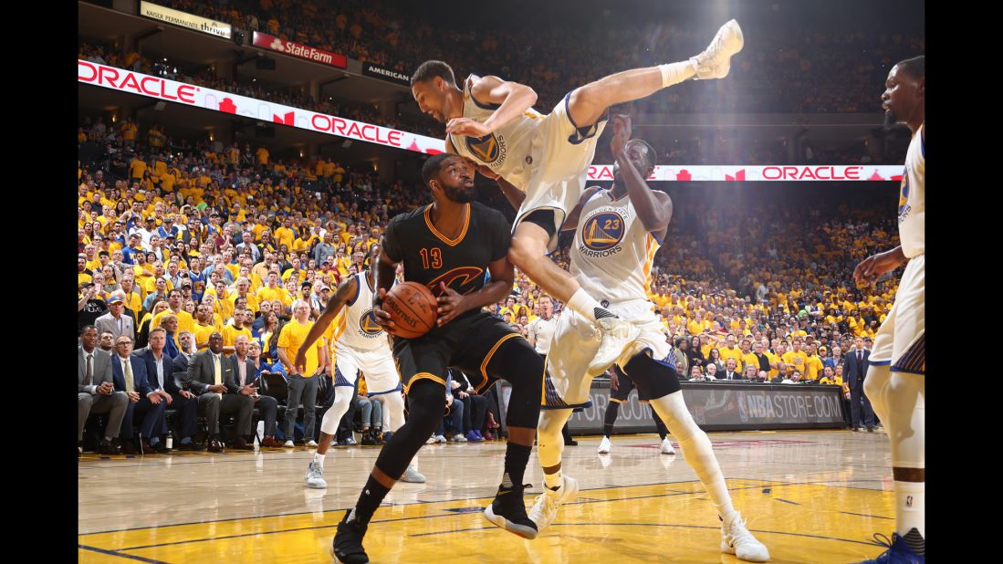 Klay Thompson falls over Tristan Thompson in the low post.