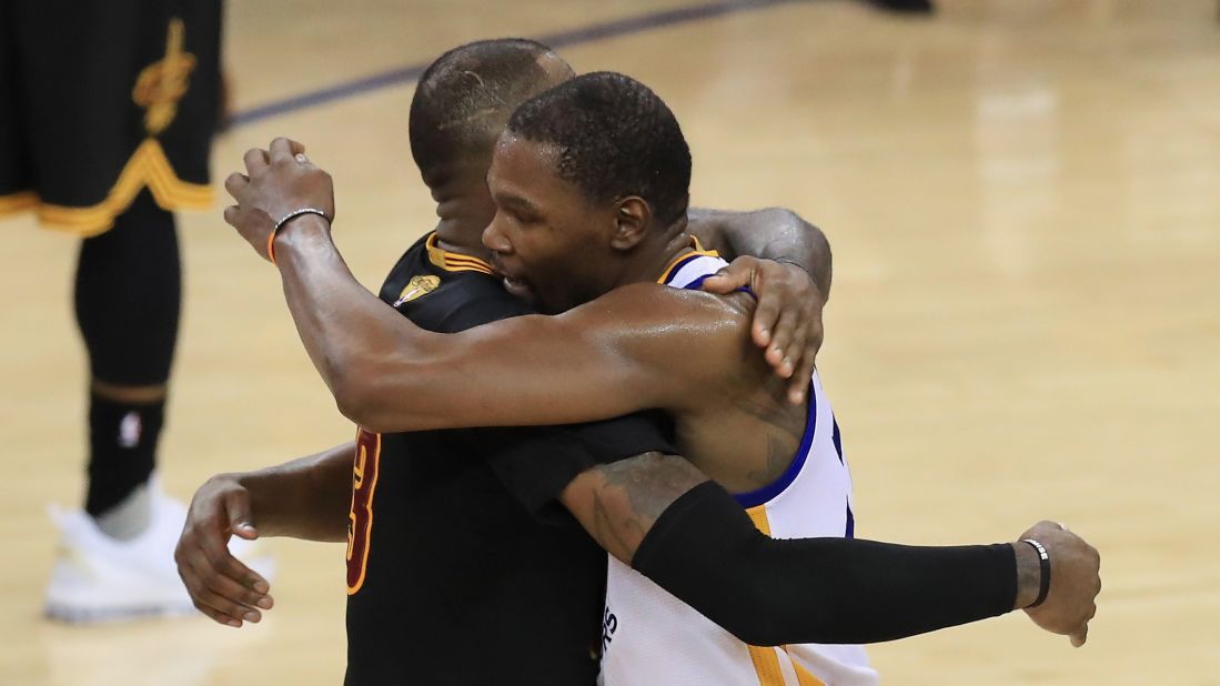 Durant hugs Cleveland star LeBron James after the game. James averaged a triple-double in the Finals: 33.6 points, 12 rebounds and 10 assists. He has played in the Finals each of the last seven seasons, with his team winning three of them.