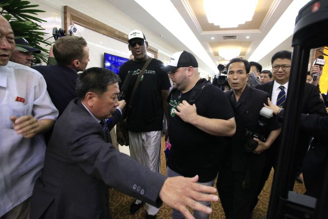 Rodman is surrounded by North Korean officials and members of the media upon arriving in Pyongyang, North Korea, on Tuesday, June 13. The <a href="index.php?page=&url=http%3A%2F%2Fwww.cnn.com%2F2017%2F06%2F13%2Fpolitics%2Fdennis-rodman-north-korea%2Findex.html" target="_blank">return trip</a> comes at a time of heightened tension between Washington and Pyongyang. When asked if he planned to talk to North Korean officials about four Americans detained there, Rodman said: "Well that's not my purpose right now. ... My purpose is to go over there and try to see if I can keep bringing sports to North Korea."