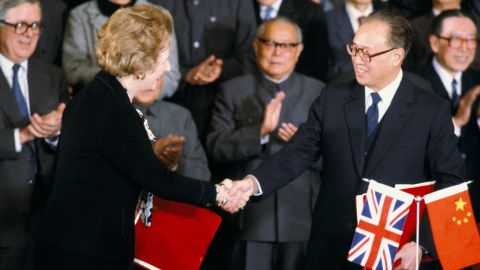 British Prime Minister Margaret Thatcher shakes hands with Chinese Premier Zhao Ziyang after signing the Sino-British Joint Declaration on December 19, 1984. 