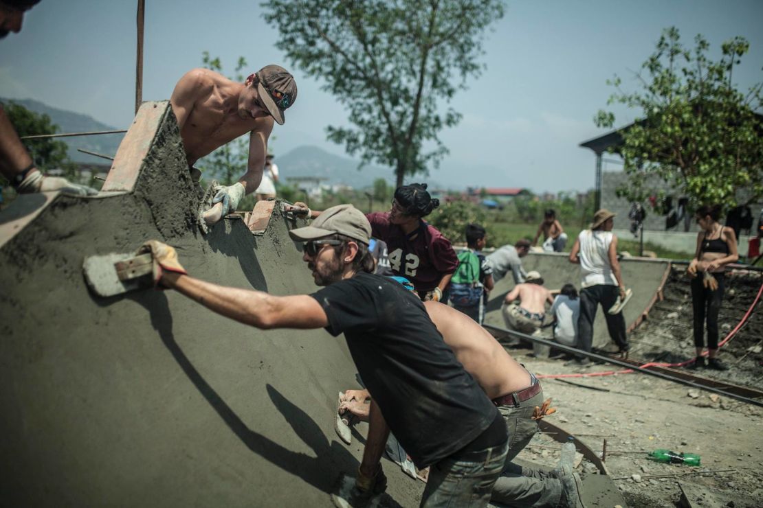 Verghese works on building a ramp inside a skate park.