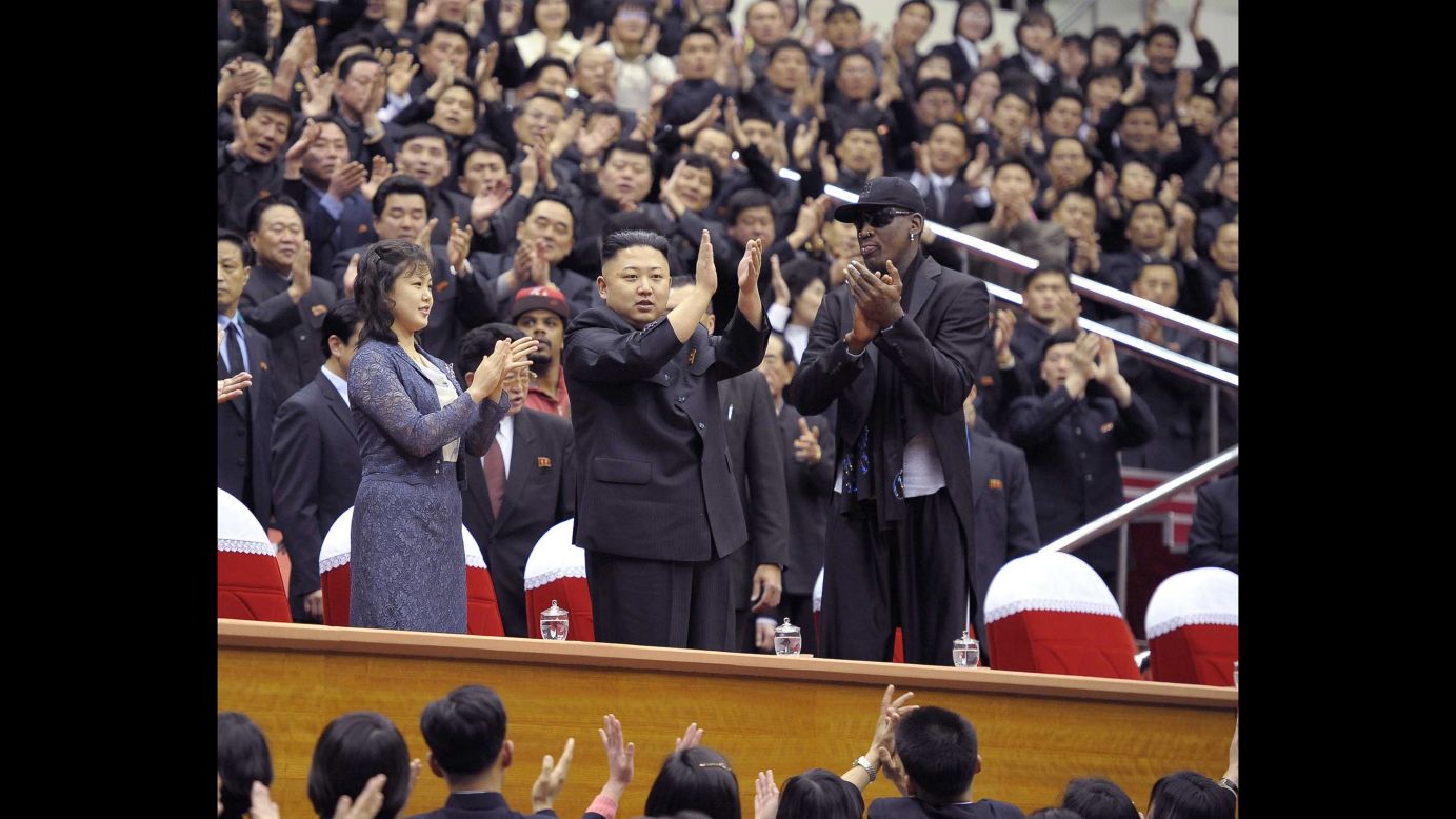 A photo released by the Korean Central News Agency shows Kim and Rodman clapping during a basketball game between the Harlem Globetrotters and players from the North Korean University of Physical Education in February 2013.