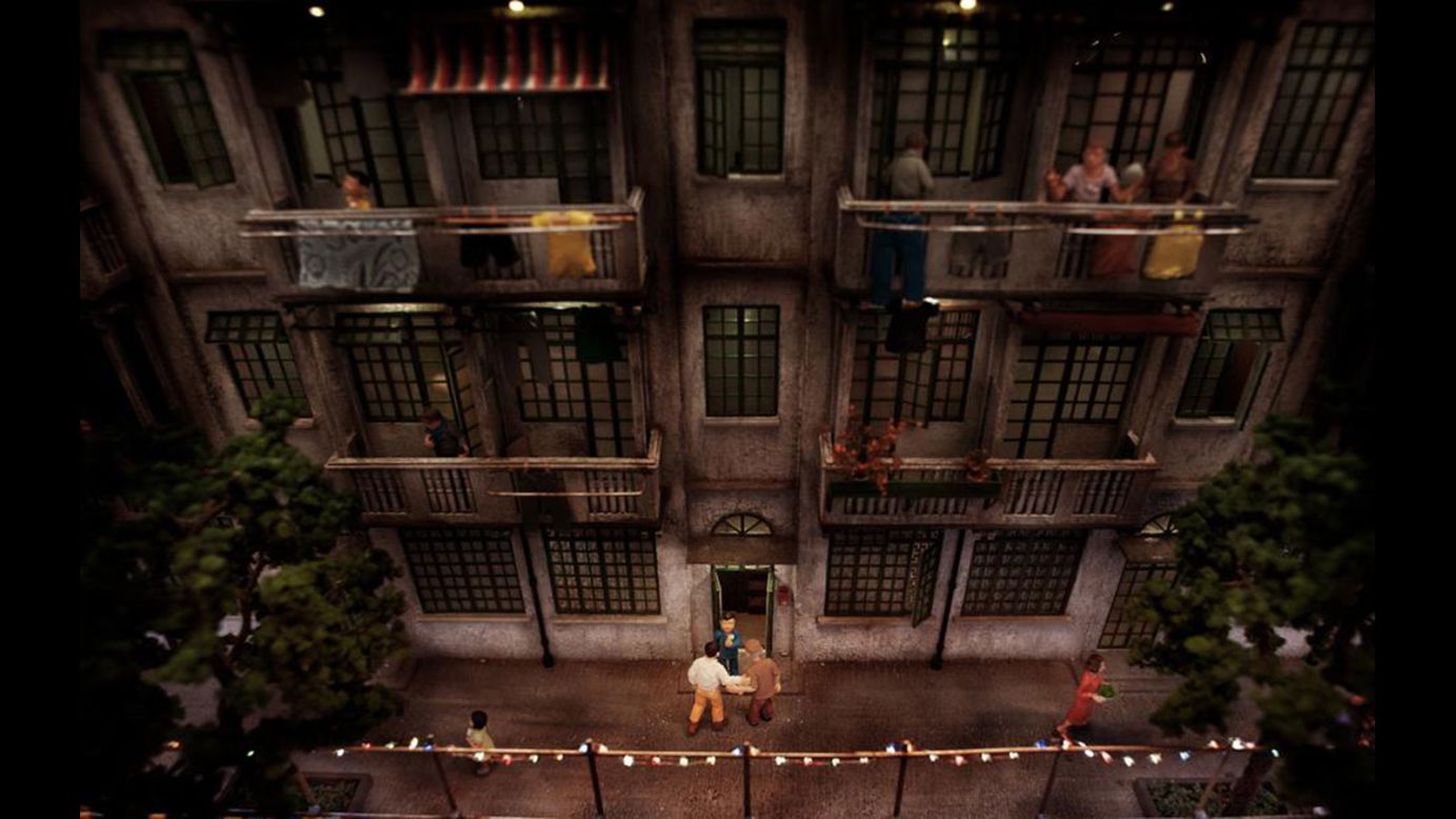 Miniature figurines and lights add life to this recreated residential building.