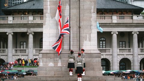 British soldiers lower the country's flag for the last time at the Cenotaph monument in central Hong Kong on June 30, 1997.