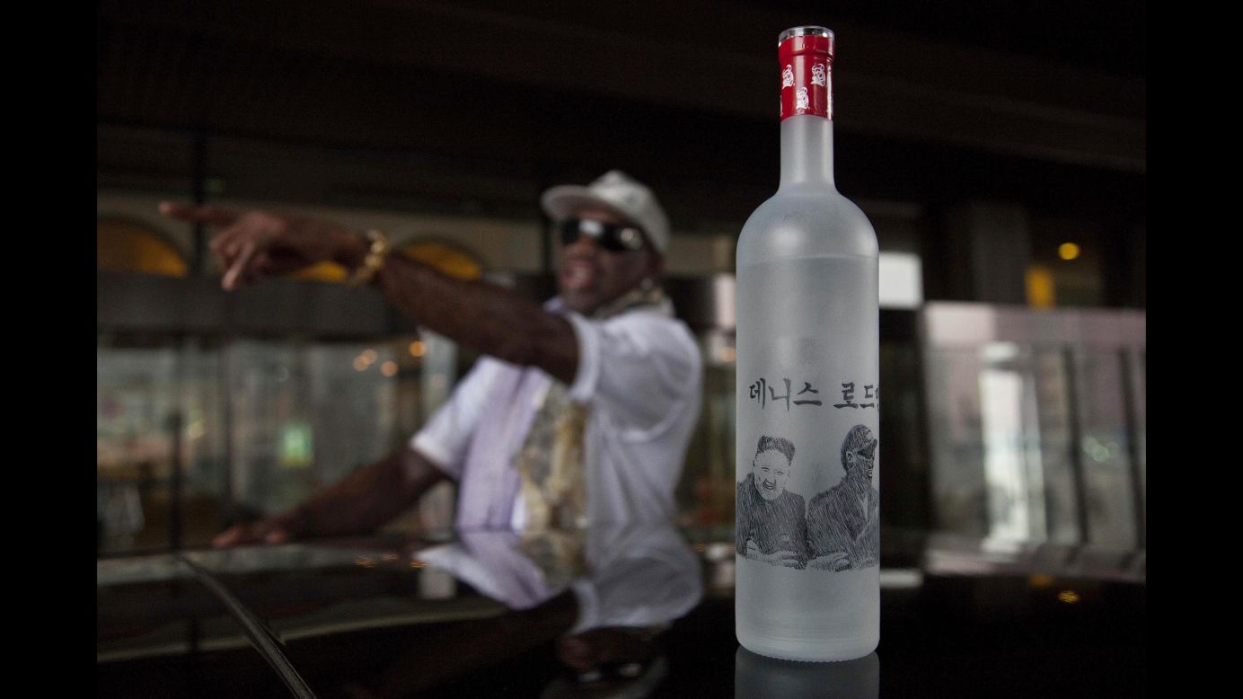 A bottle of vodka with illustrations of Rodman, Kim and Rodman's name written in Korean sits on the roof of a car outside a Pyongyang hotel in January 2014.