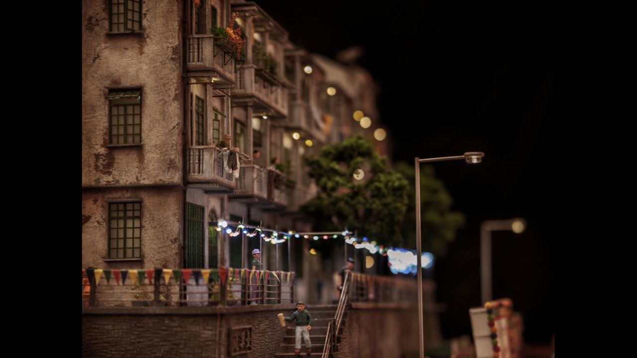 This scene depicts Hongkongers putting up festival lights and hanging their laundry from balconies.
