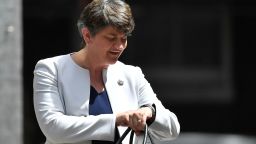 LONDON, ENGLAND - JUNE 13:  DUP leader Arlene Foster checks her watch as she arrives at 10 Downing Street on June 13, 2017 in London, England. Discussions between the DUP and the Conservative party are continuing in the wake of the UK general election as Prime Minister Theresa May looks to form a government with the help of the Democratic Unionist party's ten Westminster seats.  (Photo by Leon Neal/Getty Images)