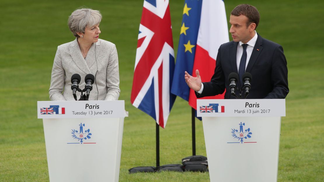 French President Emmanuel Macron and Prime Minister Theresa May speak at a joint press conference at the Elysee Palace on Tuesday. 