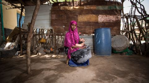 <strong>Somalia: </strong>A former child bride, now 16, holds her 2-month-old daughter outside her family's home. Somalia has an adolescent birth rate of 102.6 births per 1,000 girls 15 to 19. In the United States, that rate is 21.2 births per 1,000 girls. In Sweden, it's 5.7 births per 1,000 girls. 