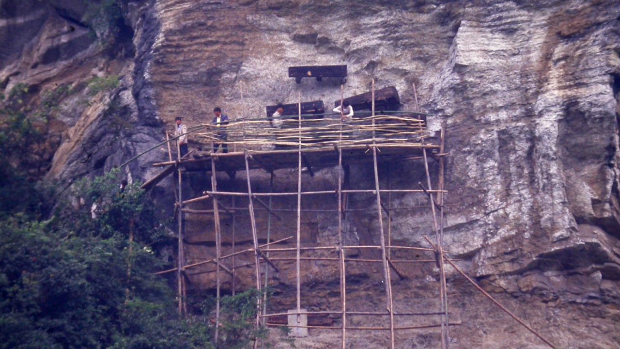Bamboo scaffolding erected to allow a CERS team to excavate the coffins in Yunnan.