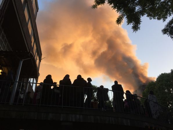 Residents of nearby Whitchurch Road watch smoke streaming from the tower.