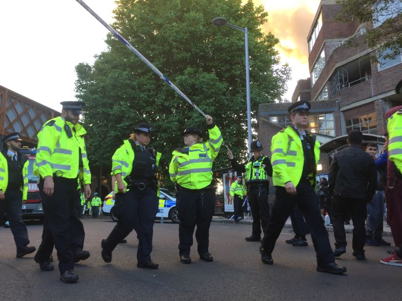 Police officers asked people to step back so they could expand the cordon and make more space for emergency services.