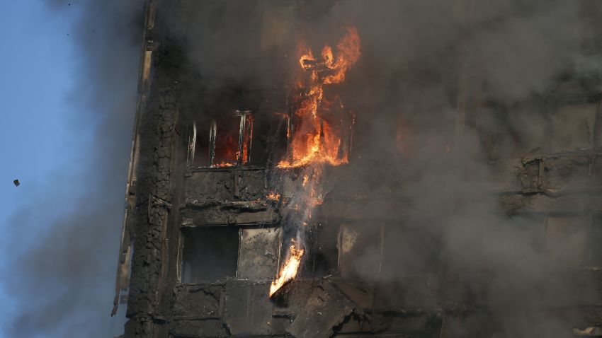 Fire rips through Grenfell Tower as firefighters attempt to control a huge blaze on June 14, 2017 in west London. 
The massive fire ripped through the 27-storey apartment block in west London in the early hours of Wednesday, trapping residents inside as 200 firefighters battled the blaze. Police and fire services attempted to evacuate the concrete block and said "a number of people are being treated for a range of injuries", including at least two for smoke inhalation.   / AFP PHOTO / Daniel LEAL-OLIVAS        (Photo credit should read DANIEL LEAL-OLIVAS/AFP/Getty Images)