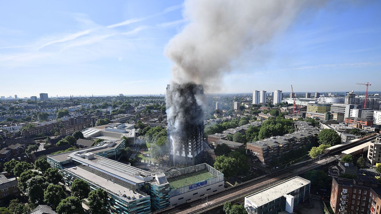Smoke rises from Grenfell Tower hours after the fire.