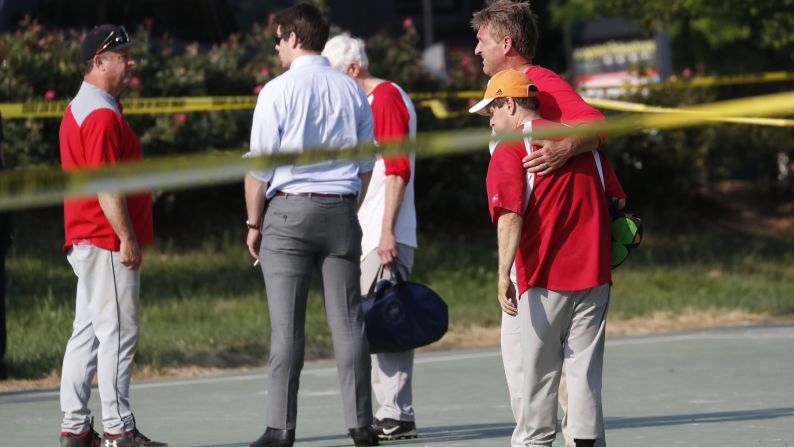 US Sen. Jeff Flake hugs another member of the Republican congressional baseball team after the shooting.