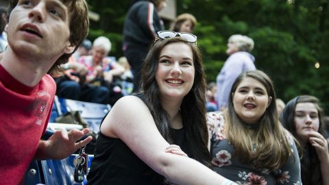 Grace Bannister joins friends before the start of "Hairspray" at Chief Logan State Park in Logan, West Virginia. "A lot of what you hear about this place is the negative, but we have so many positives," she said. "We have such a rich culture and feeling of community in this area, because when you grow up in a place of hardship, it really bonds a group of people together."