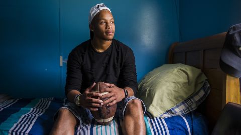 Joseph Hayes, 17, sits in his bedroom in Premier, West Virginia. Hayes has felt supported growing up black in a predominantly white community in McDowell County. "People here really don't see color."