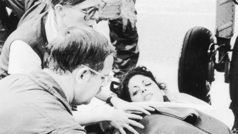 Jackie Speier, an aide to Congressman Leo Ryan, being taken from a plane at Georgetown on November 19, 1978, after its arrival from Jonestown where Speier was shot five times and Ryan and four others were ambushed and killed by members of the People's Temple.