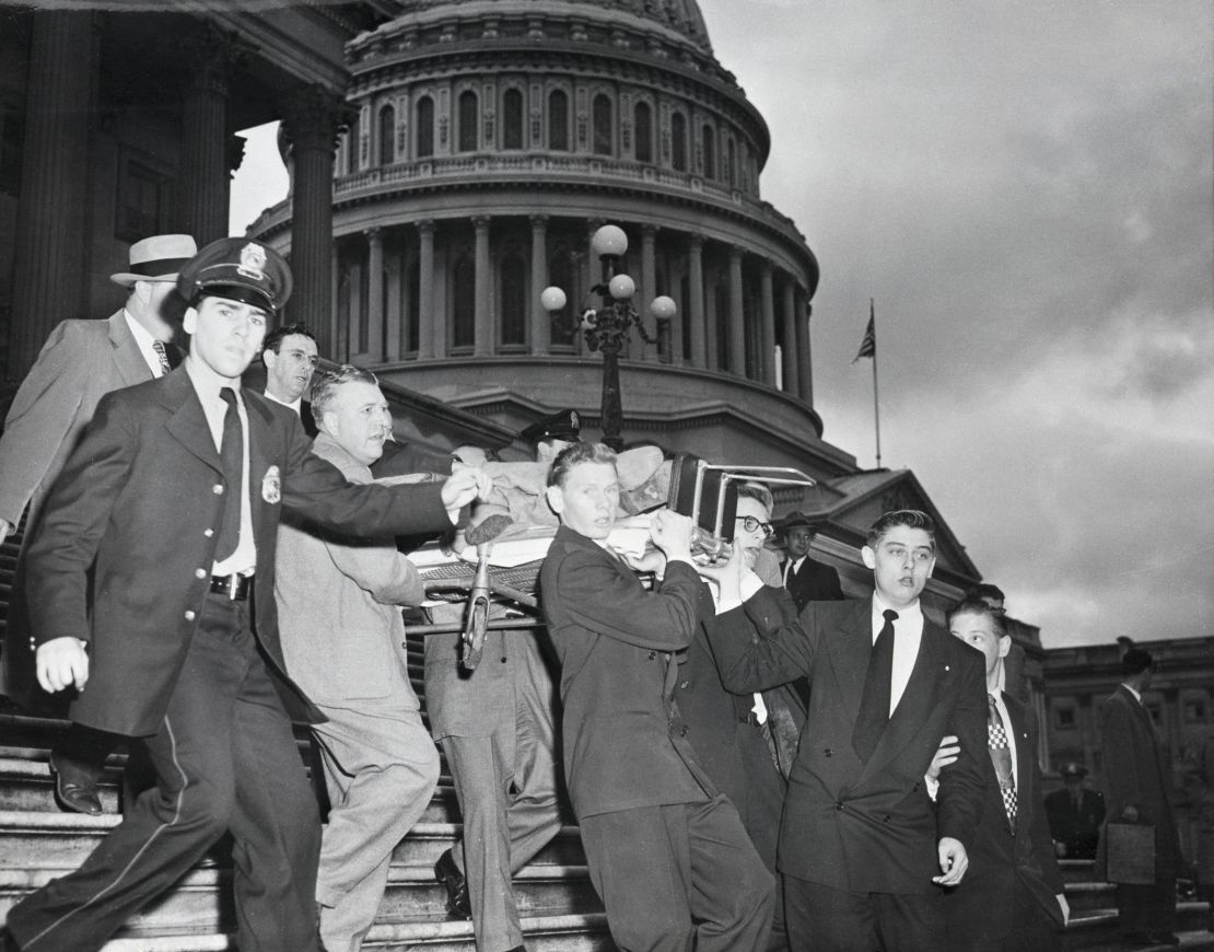 Rep. Kenneth Roberts shown here being carried down the Capitol steps after Puerto Rican nationalists opened fire in the Capitol Building, shouting "Free Puerto Rico."