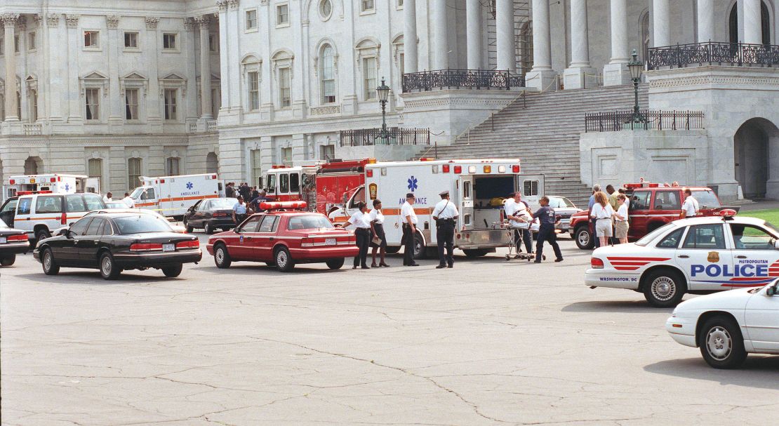 Tourists leave the Capitol on a stretcher after the violence and chaos caused by the shootings that claimed the lives of US Capitol Police officers John Gibson and Jacob J. Chestnut in 1998.