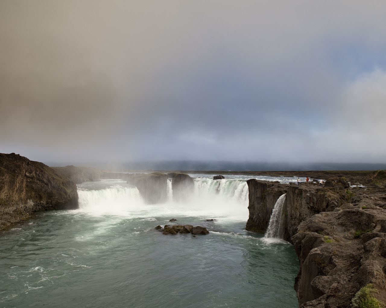<strong>Godafoss</strong> -- The "waterfall of the Gods" is a spectacular semi-circular cataract in northeast Iceland. The water of the Skjálfandafljót River falls from a height of 12 meters over a width of 30 meters. 