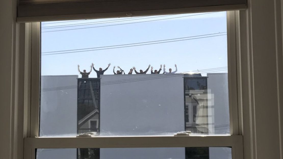 Employees at a UPS facility in San Francisco were asked to put their hands up as they left the building, according to Kevin Wood, who took this picture from his home across the street.