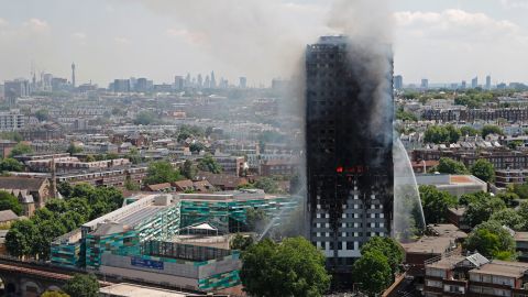 Smoke and flames billow from Grenfell Tower as firefighters attempt to control a blaze at the residential building on June 14, 2017.