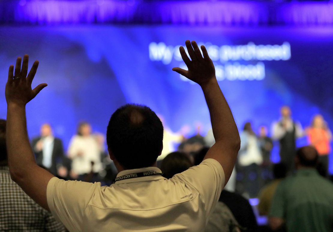 People worship during the Southern Baptist Convention annual meeting.