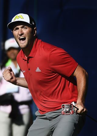 Jon Rahm celebrates holing an eagle putt on the 72nd hole to win the 2017 Farmers Insurance Open.