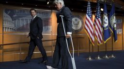 US Representative Roger Williams, Republican of Texas and a coach of the US House Republican baseball team, leaves on crutches after being injured by diving for cover during the shooting against the Republican Congressional baseball team, after speaking during a press conference on Capitol Hill in Washington, DC, June 14, 2017.