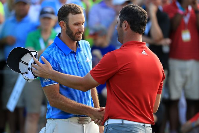 World No. 1 Dustin Johnson shakes hands with Rahm after winning the final match of the World Golf Championships Match Play  at the Austin Country Club in March 2017.