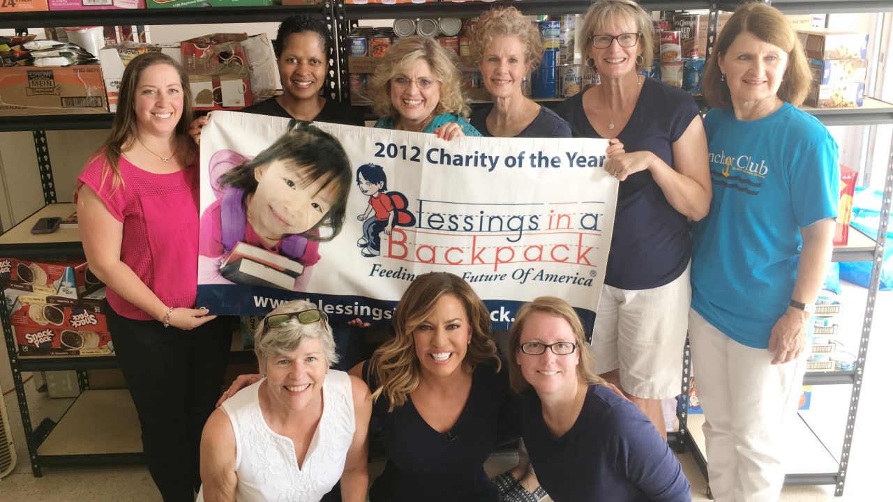 Meade joins the Blessings in a Backpack charity volunteers.