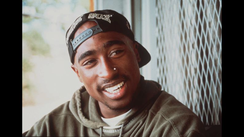 Shown here in 1993, rapper and actor Tupac Shakur was <a href="index.php?page=&url=http%3A%2F%2Fwww.cnn.com%2F2016%2F09%2F13%2Fentertainment%2Ftupac-shakur-death-anniversary%2Findex.html">shot dead on September 13, 1996,</a> on the streets of Las Vegas after attending a Mike Tyson fight at the MGM Grand. Shakur's killing remains unsolved, but many attribute his death to the decade's heated East Coast vs. West Coast rap war, which pitted Shakur against his New York rival, Christopher Wallace, aka The Notorious B.I.G.<br />