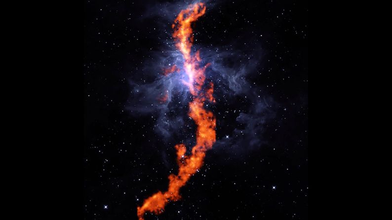 This striking image is the stellar nursery in the Orion Nebula, where stars are born. The red filament is a stretch of ammonia molecules measuring 50 light-years long. The blue represents the gas of the Orion Nebula. This image is a composite of observation from the Robert C. Byrd Green Bank Telescope and NASA's Wide-field Infrared Survey Explore telescope. "We still don't understand in detail how large clouds of gas in our Galaxy collapse to form new stars," said Rachel Friesen, one of the collaboration's co-Principal Investigators. "But ammonia is an excellent tracer of dense, star-forming gas."