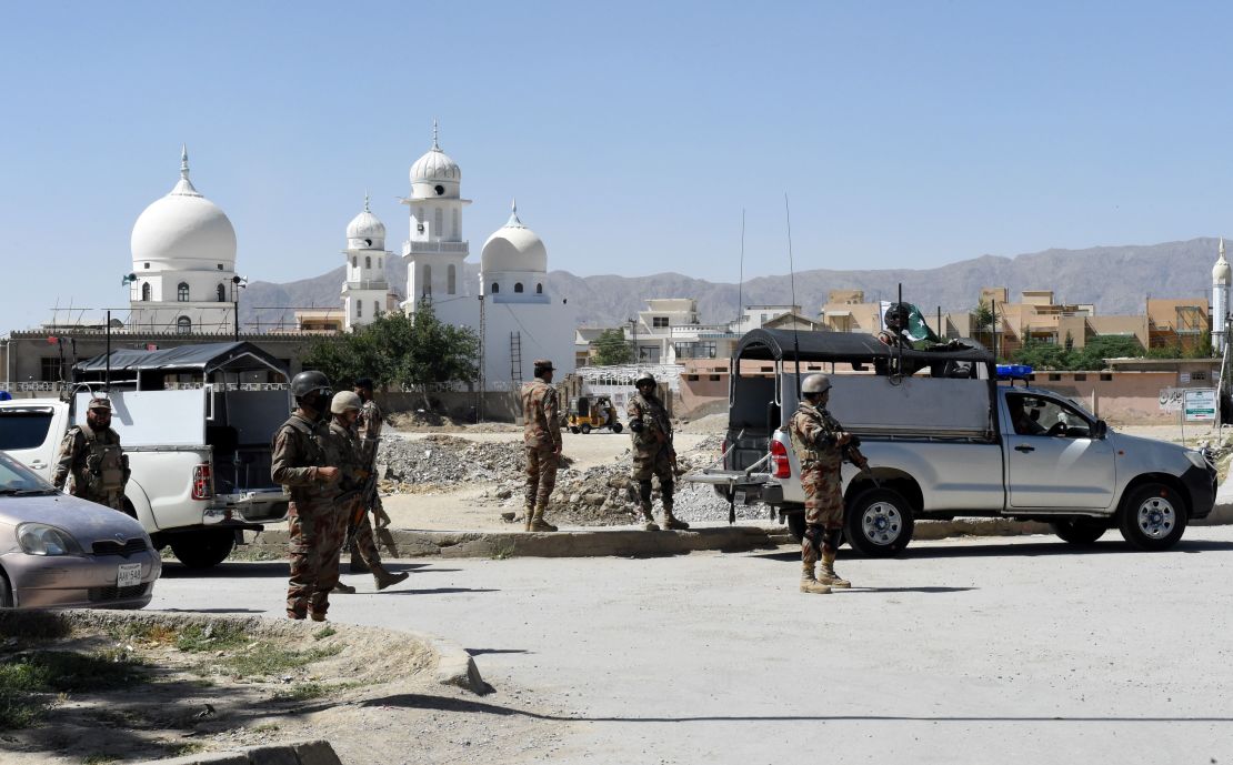 Pakistani soldiers stand guard at the site where a Chinese couple was kidnapped in the neighbourhood of Jinnah town in Quetta on May 24, 2017.
