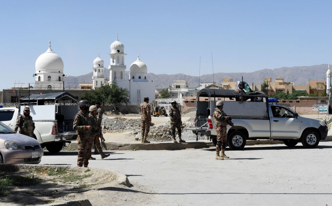 Pakistani soldiers stand guard at the site where a Chinese couple was kidnapped in the neighbourhood of Jinnah town in Quetta on May 24, 2017.