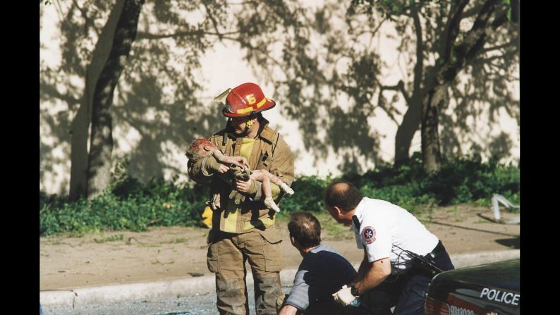 Just after 9 a.m. on April 19, 1995, a massive fertilizer bomb packed into a rental truck exploded outside Oklahoma City's Alfred P. Murrah Federal Building, <a href="index.php?page=&url=http%3A%2F%2Fwww.cnn.com%2F2013%2F09%2F18%2Fus%2Foklahoma-city-bombing-fast-facts%2Findex.html">killing 168 people and injuring more than 500</a>. This photo captured firefighter Chris Fields holding 1-year-old Angel Baylee Almon, who was thrown from the building by the blast. Almon celebrated her 1st birthday the day before the bombing, but later died from her injuries.