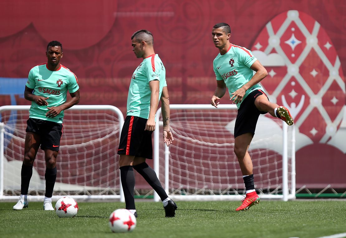 Pepe and Ronaldo take part in a training session in Kazan.