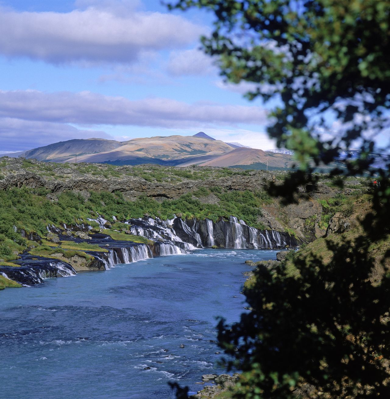 <strong>Hraunfossar -- </strong>This natural feature in western Iceland is a series of waterfalls streaming more than 900 meters out of the Hallmundarhraun lava field. 