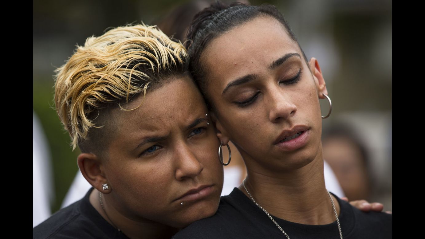 Angel Ayala, left, and her girlfriend, Carla Montanez, attend a memorial service at the Pulse nightclub in Orlando on Monday, June 12. <a href="http://www.cnn.com/2017/06/12/us/gallery/pulse-memorial/index.html" target="_blank">A vigil was held at the club</a> a year after a mass shooting claimed 49 lives there.
