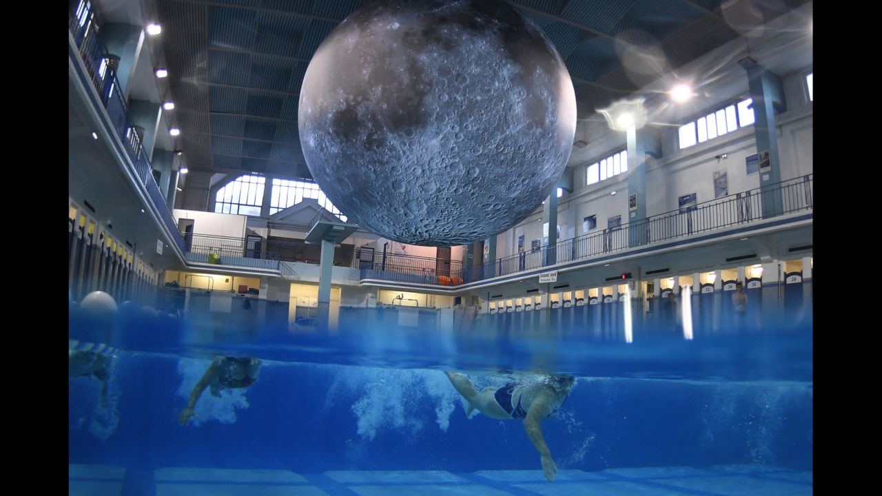 People in Rennes, France, swim under "Museum of the Moon," an installation by British artist Luke Jerram, at the Saint-Georges public swimming pool on Monday, June 12. The artwork features detailed NASA images of the moon's surface.