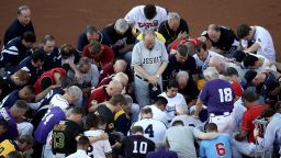 WASHINGTON, DC - JUNE 15:  Members of the Republican and Democratic congressional baseball teams gather for a bipartisan prayer before the start of the Congressional Baseball Game at Nationals Park on June 15, 2017 in Washington, DC. U.S. House Majority Whip Rep. Steve Scalise (R-LA) is in critical condition following a shooting yesterday during a Republican congressional baseball team practice.  (Photo by Win McNamee/Getty Images)