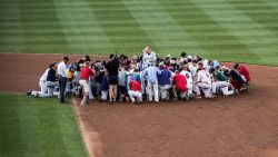 A prayer is held prior to the start of the Congressional Baseball Game at National Park in Washington, DC on June 15, 2017.