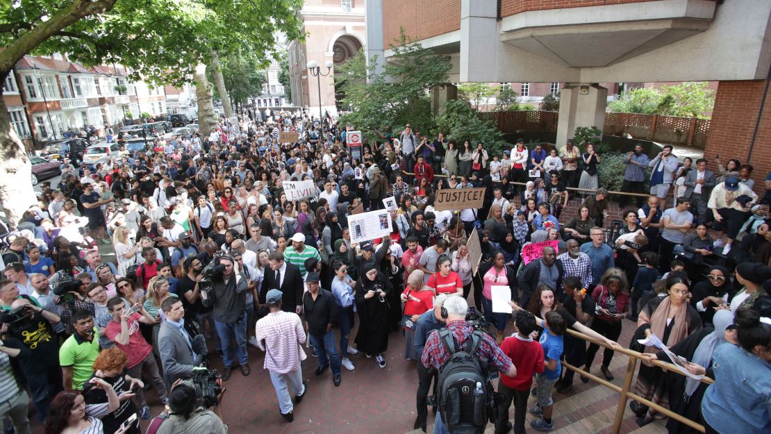 Protesters gather Friday demanding answers outside Kensington Town Hall in west London.