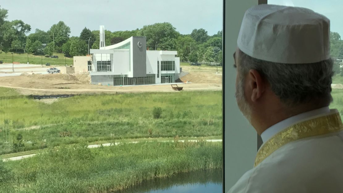 Imam Mohamad Jamal Daoudi peers out the window of Temple Israel and sees his new mosque.
