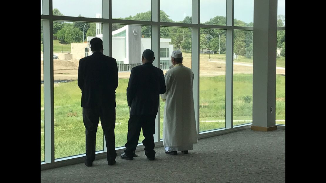 The three faith leaders look out on the former golf course, now the home of the Tri-Faith campus.