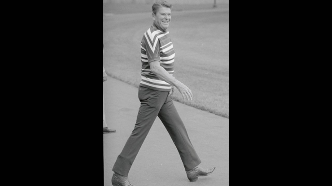 President Ronald Reagan in weekend wear and boots on his way from the White House lawn to Marine One, headed to Camp David, August 1982.