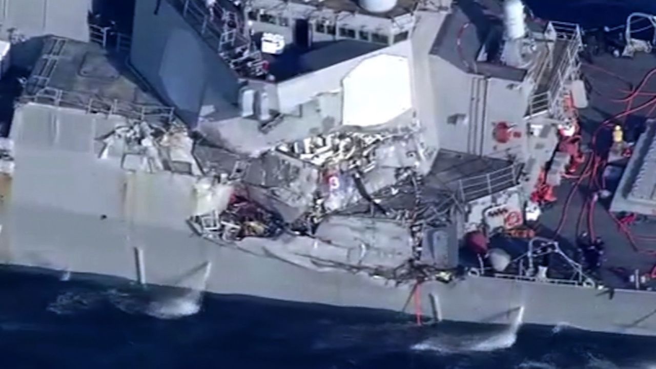 A photo from shipping company NYK shows damage from the collision.